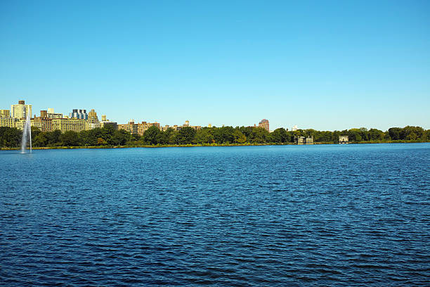 istock Blue River and City View At The Background With Greens 618970462