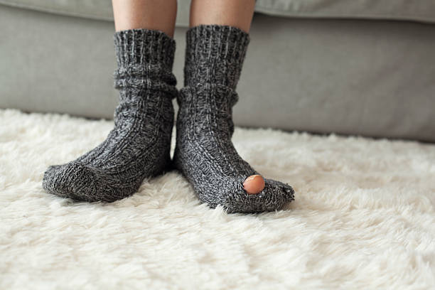 istock Woman leg in rip sock 618971090