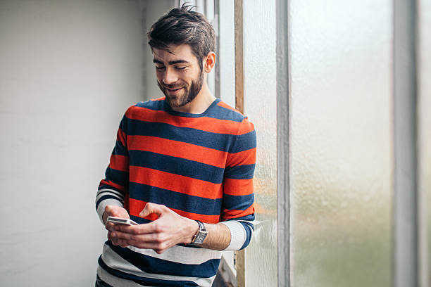 istock Young man chatting on the phone 618971600