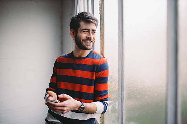 istock Young man chatting on the phone 618971704