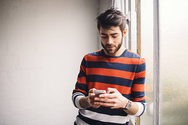 istock Young man chatting on the phone 618971872