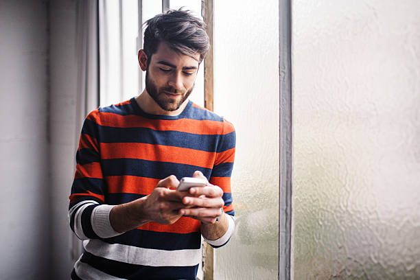 istock Young man chatting on the phone 618971998