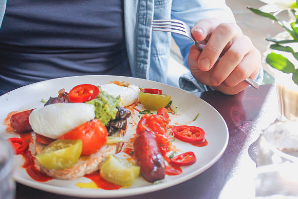 istock Adult man enjoy eating healthy breakfast 618972344