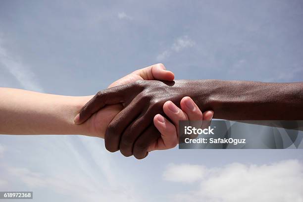 Black And White Human Hands Stock Photo - Download Image Now - Refugee, Black Color, White Color