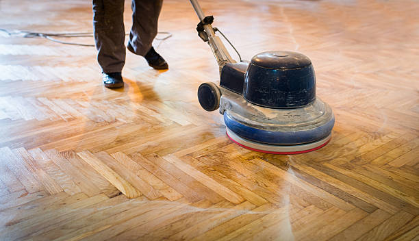 Home renovation, parquet sanding, polishing stock photo