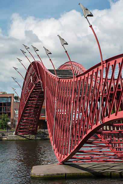 istock Red pedestrian bridge in Amsterdam over the river 618972644