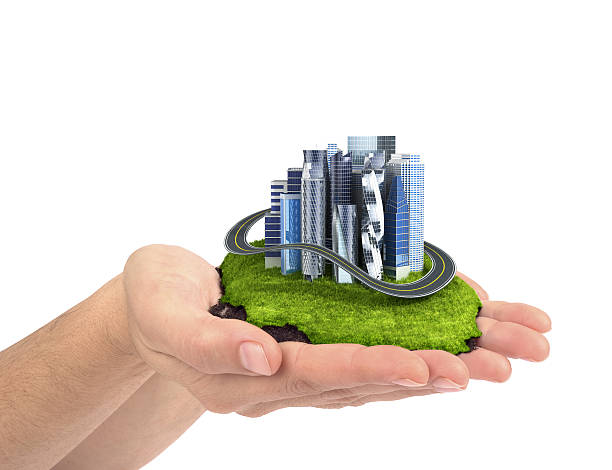 istock human hand holding the city. 618975890