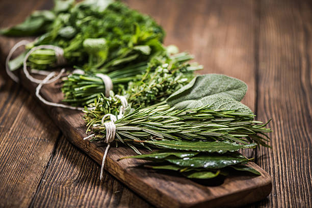 natural aromatic herbs natural aromatic herbs on wooden board mint leaf culinary stock pictures, royalty-free photos & images