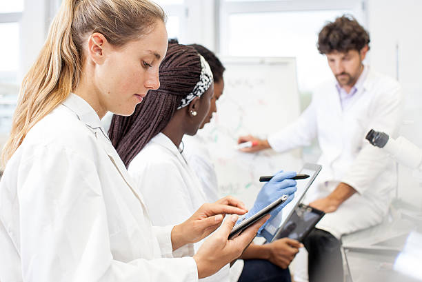 istock Group of Scientists Discussing New Findings on a Lab Meeting 618977436