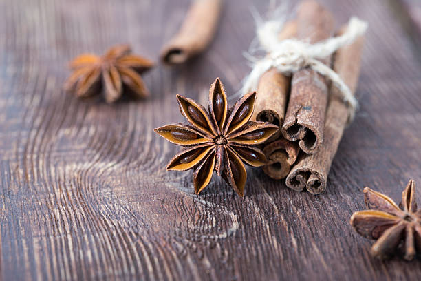 istock cinnamon and star anise on a wooden background . close-up 618978428