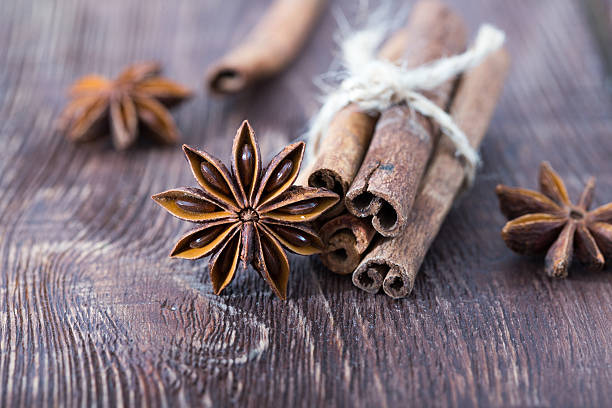 istock cinnamon and star anise on a wooden background . close-up 618978518