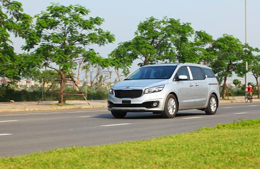 Hanoi, Vietnam - Apr 20, 2015: Kia Grand Sedona car on the test drive in Vietnam