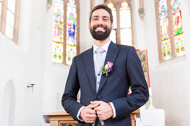 Groom on wedding waiting for bride at altar