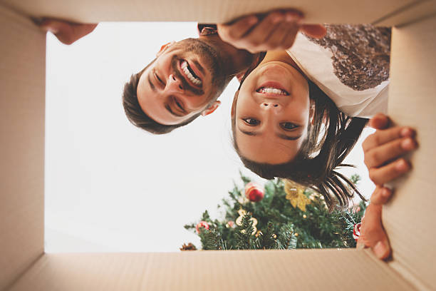 istock Father and daughter opening a Christmas present 619044958