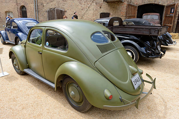 Jüchen, Germany - August 5, 2016: Volkswagen Beetle or VW Bug army vehicle on display during the 2016 Classic Days event at Schloss Dyck. The two-door, four passenger, rear-engine economy car has been manufactured from 1938 until 2003. The cars are on display during the 2016 Classic Days event at Schloss Dyck.