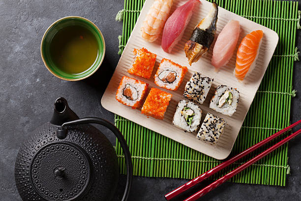istock Set of sushi, maki and green tea 619046940