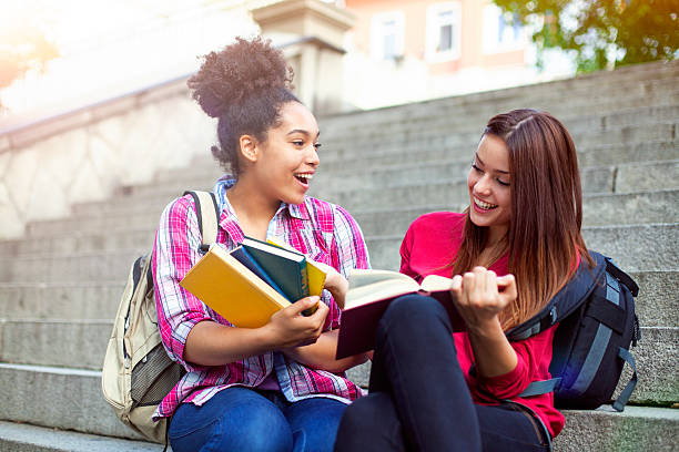 istock Students outdoor with books 619049364