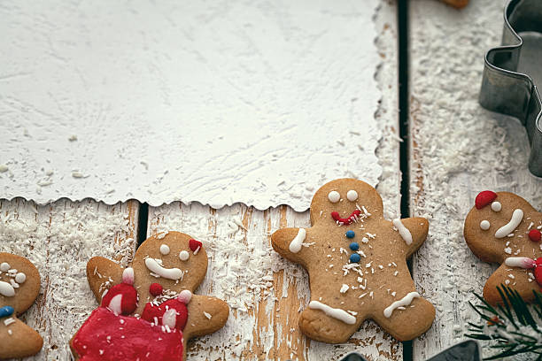 istock Christmas wooden background with gingerbread and snow 619050472