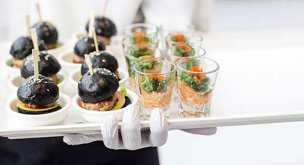 istock with white rubber glove holding plate banquet business 619051096