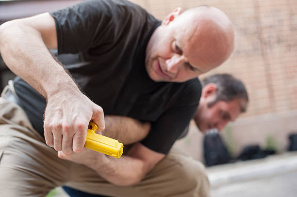 Gun Disarm. Self defense techniques against a gun point.