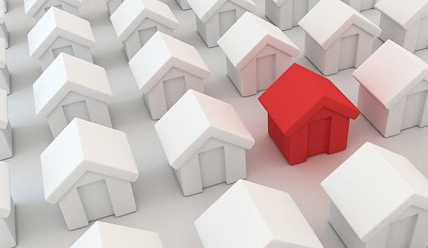 istock Abstract many homes and one red home 619052214
