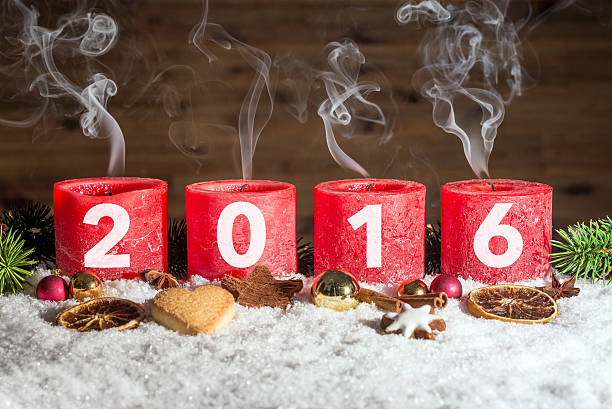 istock Four blown out advent candles with 2016 in snow 619052300