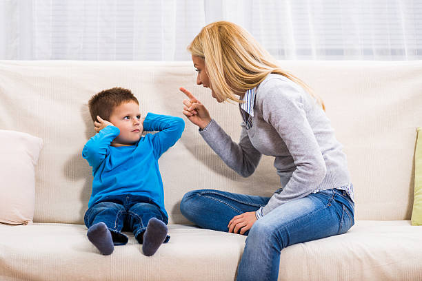 Family conflict Angry mother is scolding at her son. screaming stock pictures, royalty-free photos & images