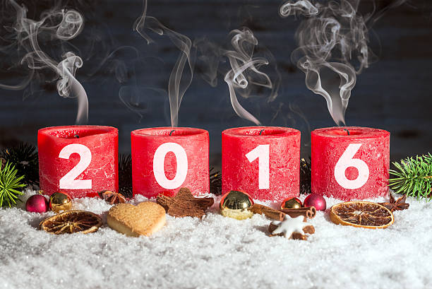 istock Four blown out advent candles with 2016 in snow 619052504