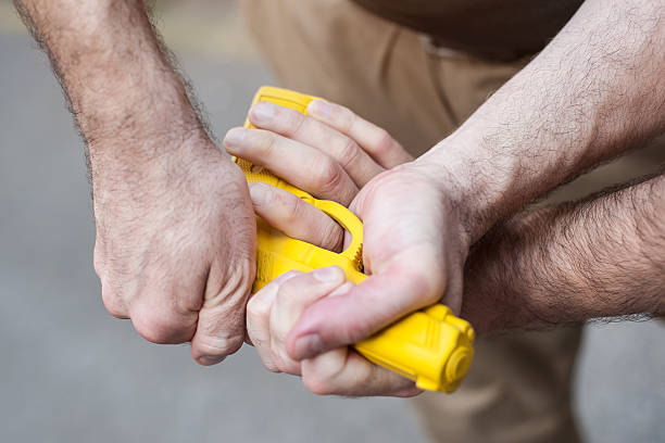 istock Gun Disarm. Self defense techniques against a gun point. 619052582