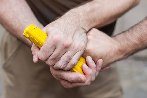 istock Gun Disarm. Self defense techniques against a gun point. 619052652