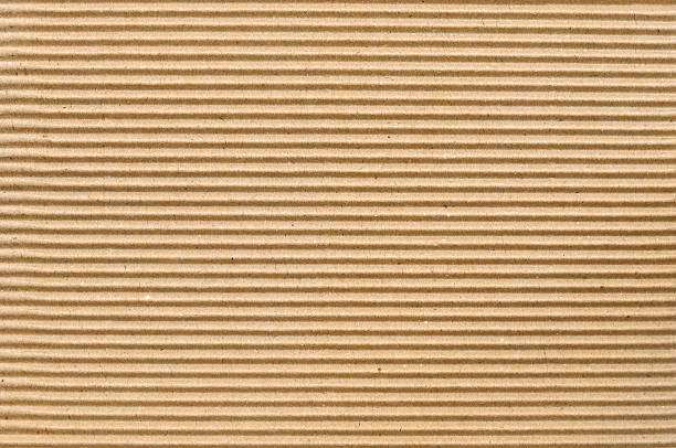 brun carton ondulé utile comme arrière-plan - brown paper paper striped corrugated cardboard photos et images de collection