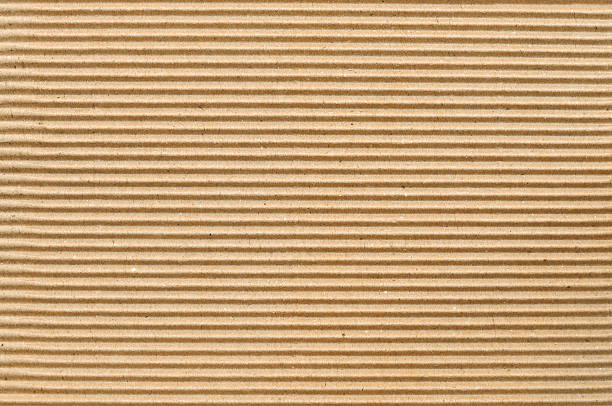 papelão corrugado pardo útil como um fundo - corrugated cardboard - fotografias e filmes do acervo