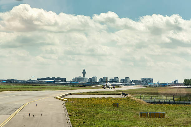 Taxiing at Amsterdam Schiphol Airport stock photo