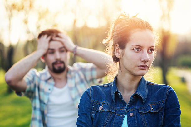 Troubles in the relationship Couple having argument in the park clingy girlfriend stock pictures, royalty-free photos & images