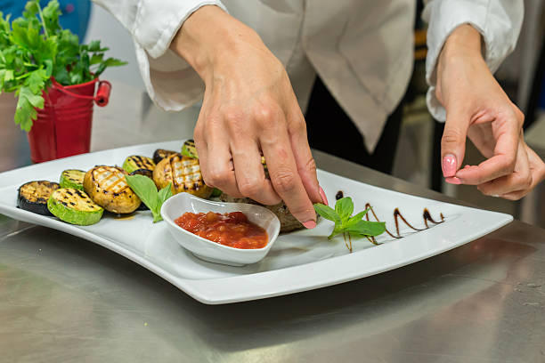 istock Cook prepares meals in the restaurant presentation. 619055422