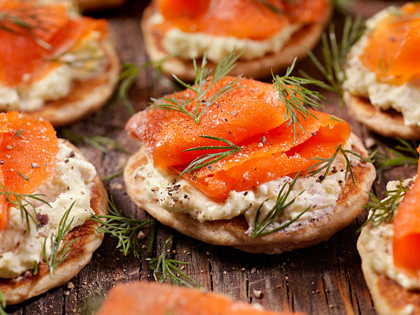 Smoked Salmon Bilini with Avocado Cream Cheese Smoked Salmon Canapes with Avocado Cream Cheese and Fresh Dill  -Photographed on Hasselblad H3D2-39mb Camera canape stock pictures, royalty-free photos & images