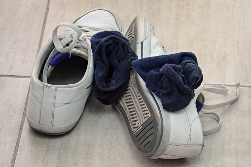 Suede sneakers before and after cleaning with a cleaner. Shoe care.