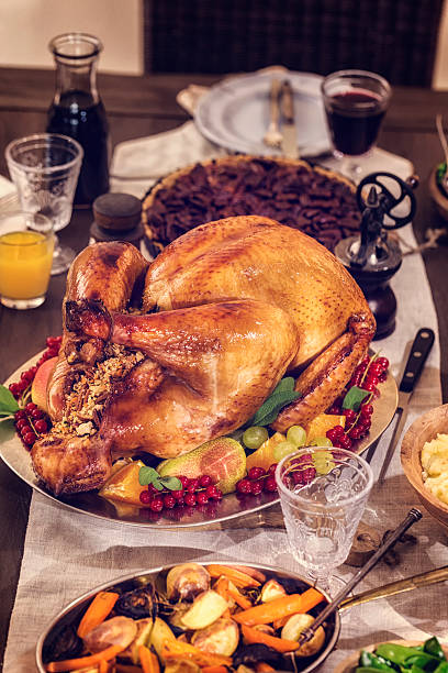istock Traditional Stuffed Turkey Holiday Dinner with Vegetables and Pumpkin Pie 619058160