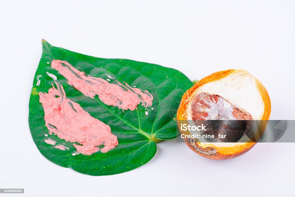Chewing betel nut and betel and  red lime Chewing betel nut and betel and  red lime is the culture of the ASEAN on white background Areca Stock Photo
