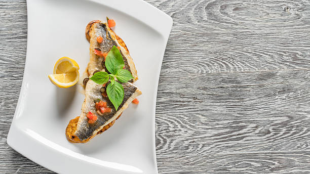 istock Sea bass fillet with vegetables 619058446