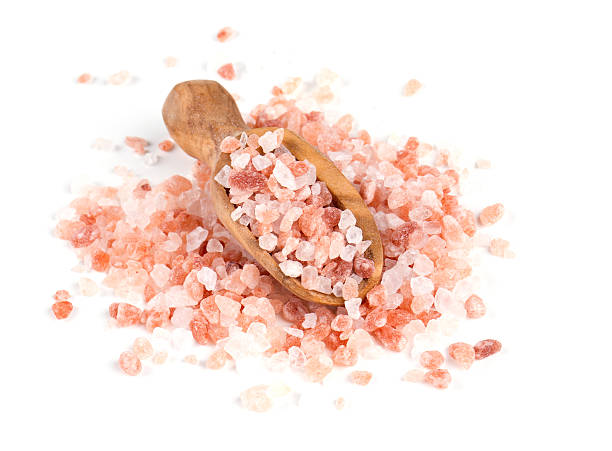 istock himalayan salt on a wooden spoon over white 619061412