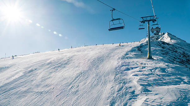 istock Group of skiers moving down on ski slope 619062886