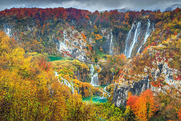 Spectacular autumn landscape with magical waterfalls in Plitvice lakes,Croatia Stunning view of the most famous waterfalls in Plitvice National Park,Croatia,Europe plitvice lakes national park stock pictures, royalty-free photos & images