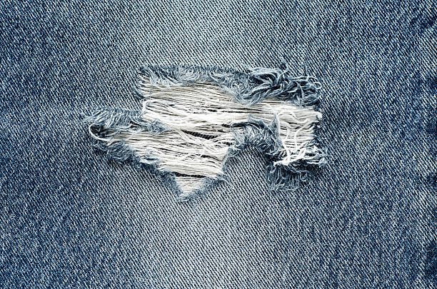 istock .Denim jeans texture or denim jeans background with old torn. 619064184