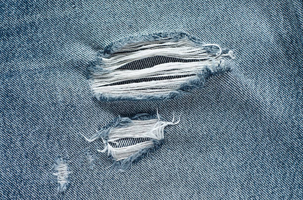 istock .Denim jeans texture or denim jeans background with old torn. 619064632