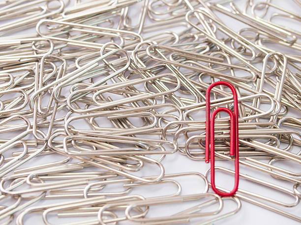 istock Red paper clip stand different from the crowd 619064698