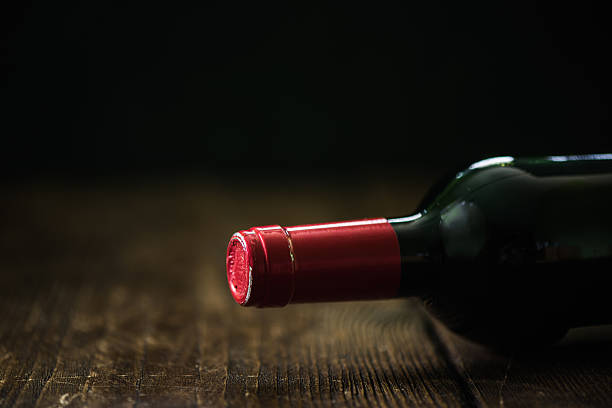 red wine bottle on wooden talbe