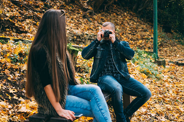 istock Couple Photogrpahing each other 619065624