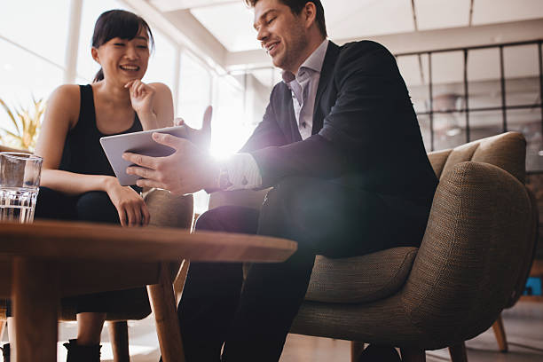 istock Business people discussing project on digital tablet 619065790