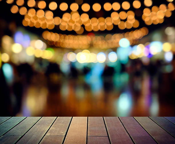 istock image of wooden table in front of abstract blurred background 619065870